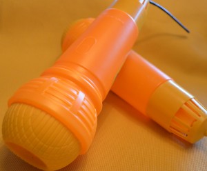 Supporting a Child With Delayed Speech or Language Development with a plastic toy Echo Mic Echo Mic Used With Delayed Speech or Language Development